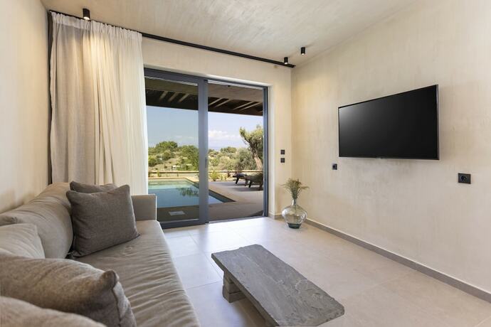 Imagen de la habitación del Hotel Pnoes Luxury Suites. Foto 19