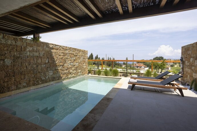 Imagen general del Hotel Pnoes Luxury Suites. Foto 9