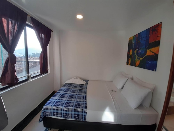 Imagen de la habitación del Hotel Poblado Guest House. Foto 15