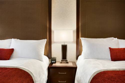 Imagen de la habitación del Hotel Poco Inn and Suites and Conference Centre. Foto 6