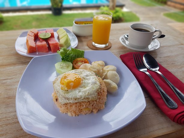 Imagen del bar/restaurante del Hotel Poedja Villa Jimbaran. Foto 8