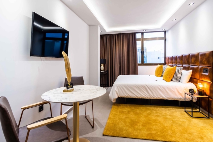 Imagen de la habitación del Hotel Poem Suites. Foto 5