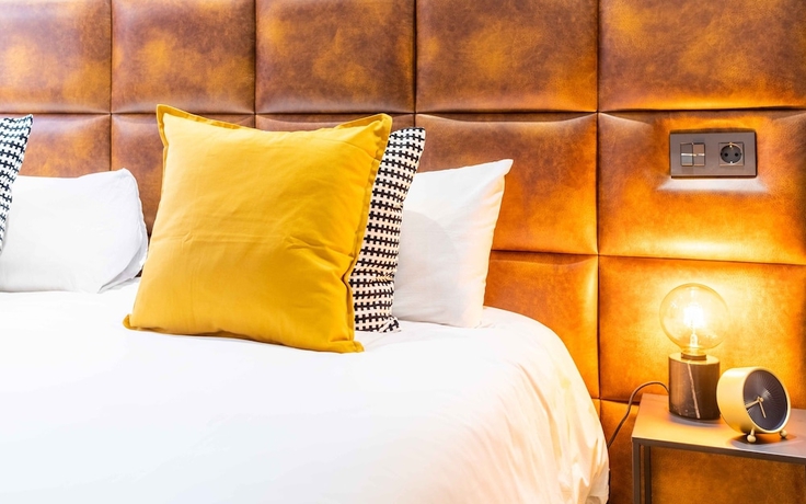 Imagen de la habitación del Hotel Poem Suites. Foto 12