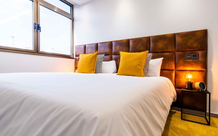 Imagen de la habitación del Hotel Poem Suites. Foto 18