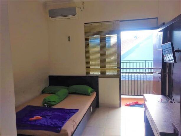 Imagen de la habitación del Hotel Poetri Guest House Syariah. Foto 16