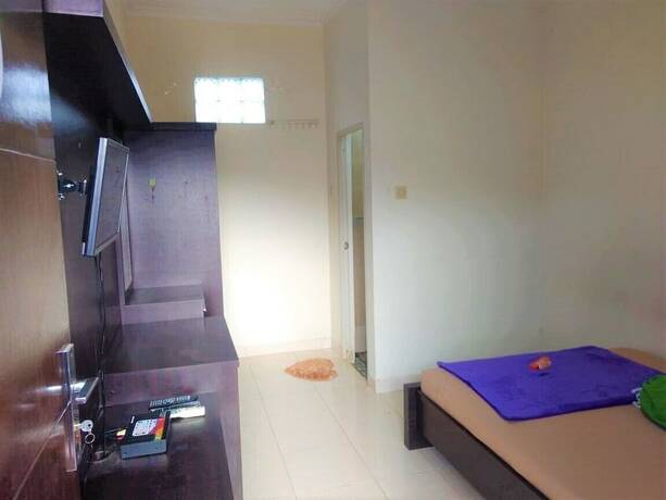 Imagen de la habitación del Hotel Poetri Guest House Syariah. Foto 17