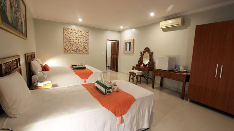 Imagen de la habitación del Hotel Poinciana Resort Bali. Foto 18