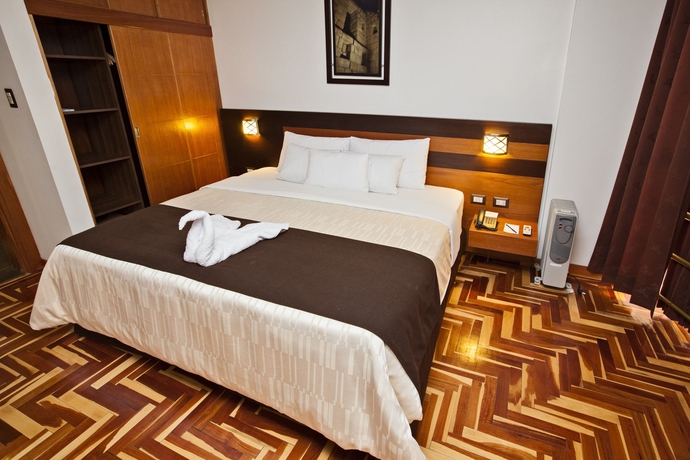 Imagen de la habitación del Hotel Polo Cusco Suites. Foto 12