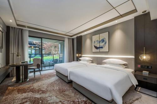 Imagen de la habitación del Hotel Poltton Century - Changtai Taoli Chunfeng Branch. Foto 19