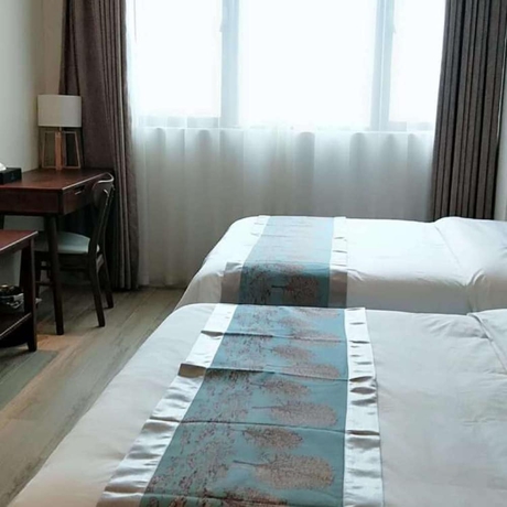 Imagen de la habitación del Hotel Poltton International Apartment Jinding. Foto 4
