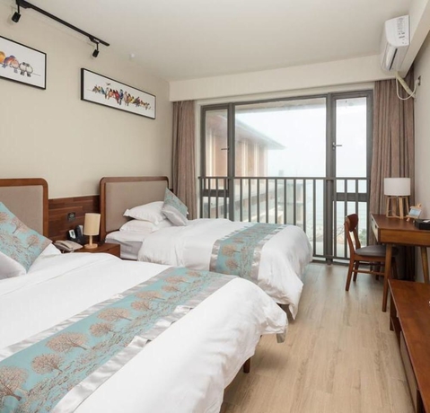 Imagen de la habitación del Hotel Poltton International Apartment Jinding. Foto 13