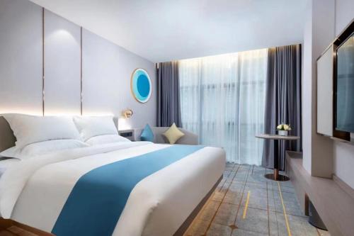 Imagen de la habitación del Hotel Poltton International Guangzhou Panyu Nancun Branch. Foto 9