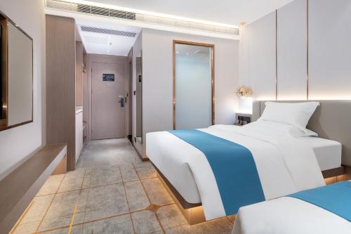Imagen de la habitación del Hotel Poltton International - Huizhou University of economics. Foto 16