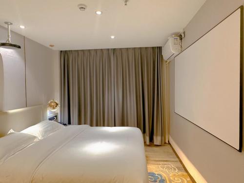 Imagen de la habitación del Hotel Poltton International - Huizhou University of economics. Foto 19