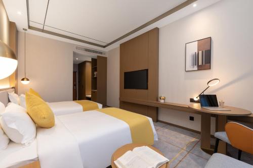 Imagen de la habitación del Hotel Poltton International Service Apartments - Zhuhai Gongbei Port Fuhuali. Foto 17