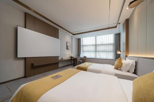 Imagen de la habitación del Hotel Poltton International Service Apartments - Zhuhai Gongbei Port Fuhuali. Foto 18