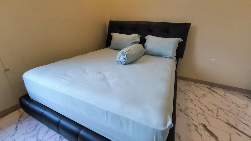 Imagen de la habitación del Hotel Pomah Guesthouse. Foto 1