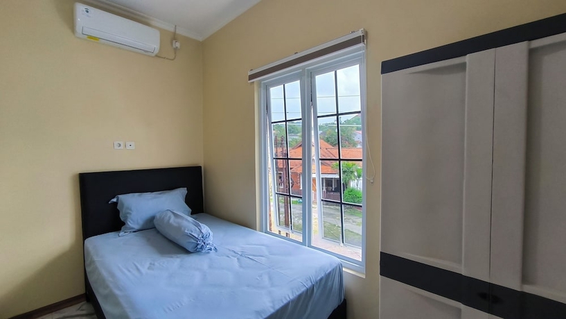 Imagen de la habitación del Hotel Pomah Guesthouse. Foto 5