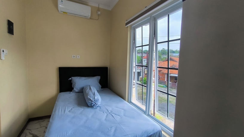 Imagen de la habitación del Hotel Pomah Guesthouse. Foto 6