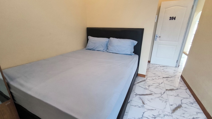 Imagen de la habitación del Hotel Pomah Guesthouse. Foto 8