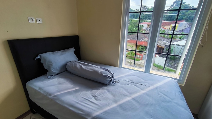 Imagen de la habitación del Hotel Pomah Guesthouse. Foto 9