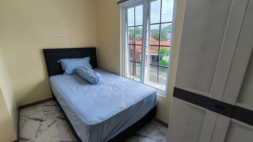 Imagen de la habitación del Hotel Pomah Guesthouse. Foto 11