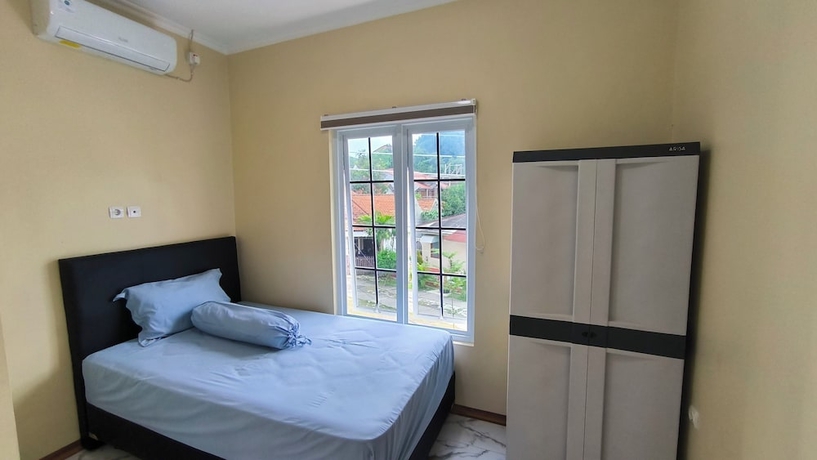 Imagen de la habitación del Hotel Pomah Guesthouse. Foto 13