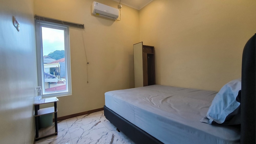 Imagen de la habitación del Hotel Pomah Guesthouse. Foto 15