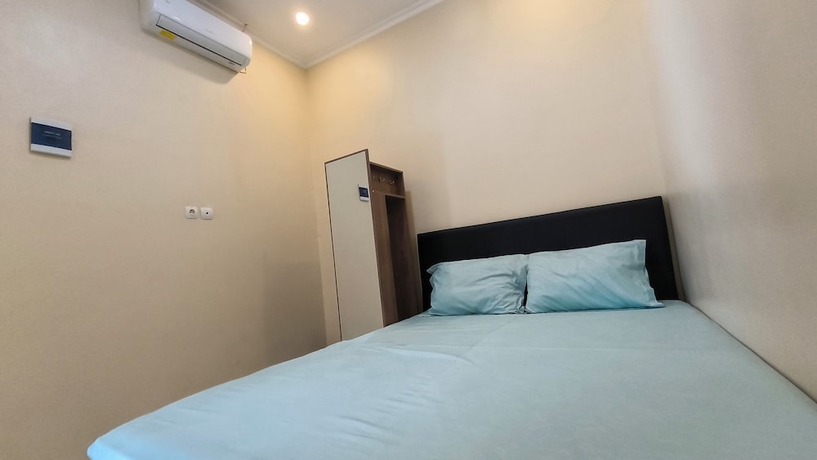 Imagen de la habitación del Hotel Pomah Guesthouse. Foto 16
