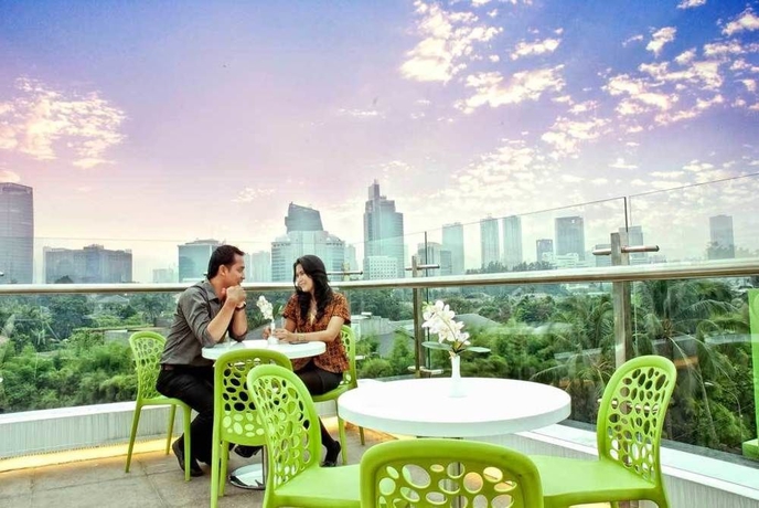 Imagen del bar/restaurante del Hotel Pomelotel Patra Kuningan Jakarta. Foto 1