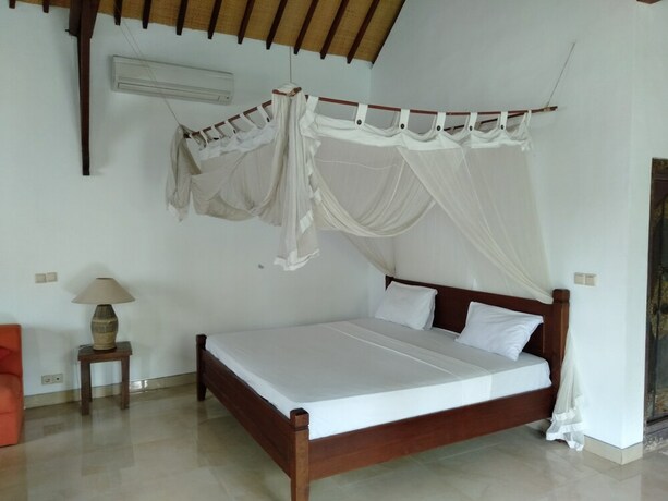 Imagen de la habitación del Hotel Pondok Alit Resort. Foto 31