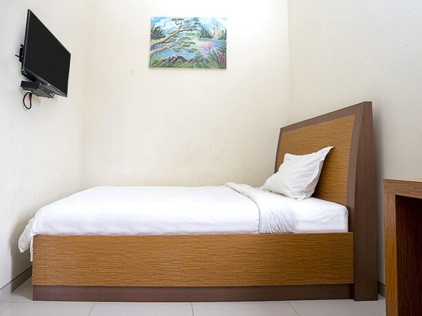 Imagen de la habitación del Hotel Pondok Indah Homestay by ecommerceloka. Foto 14