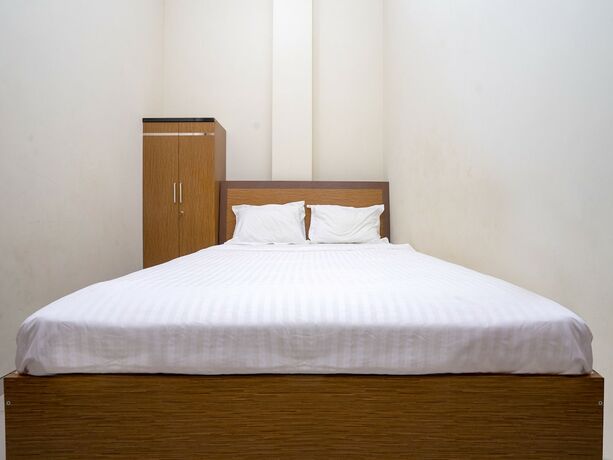 Imagen de la habitación del Hotel Pondok Indah Homestay by ecommerceloka. Foto 15