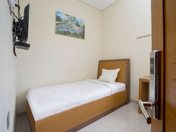 Imagen de la habitación del Hotel Pondok Indah Homestay by ecommerceloka. Foto 16