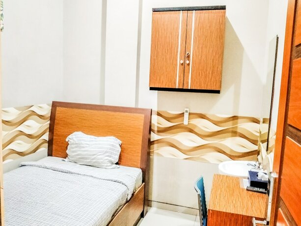 Imagen de la habitación del Hotel Pondok Indah Homestay by ecommerceloka. Foto 17