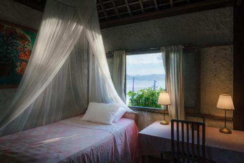 Imagen de la habitación del Hotel Pondok Pisang Candidasa. Foto 6