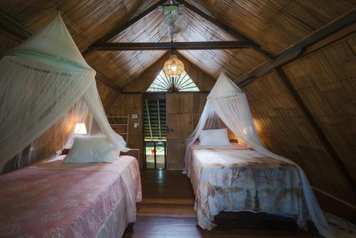 Imagen de la habitación del Hotel Pondok Pisang Candidasa. Foto 7