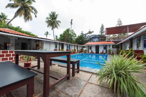 Imagen general del Hotel Pool Side Cottages. Foto 4