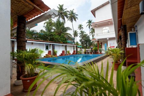 Imagen general del Hotel Pool Side Cottages. Foto 9