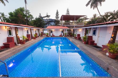 Imagen general del Hotel Pool Side Cottages. Foto 11