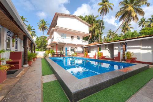 Imagen general del Hotel Pool Side Cottages. Foto 12