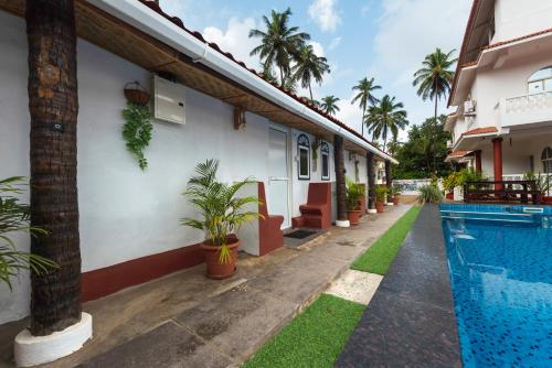 Imagen general del Hotel Pool Side Cottages. Foto 14
