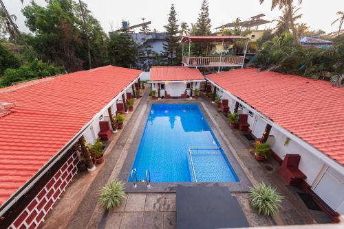 Imagen general del Hotel Pool Side Cottages. Foto 15