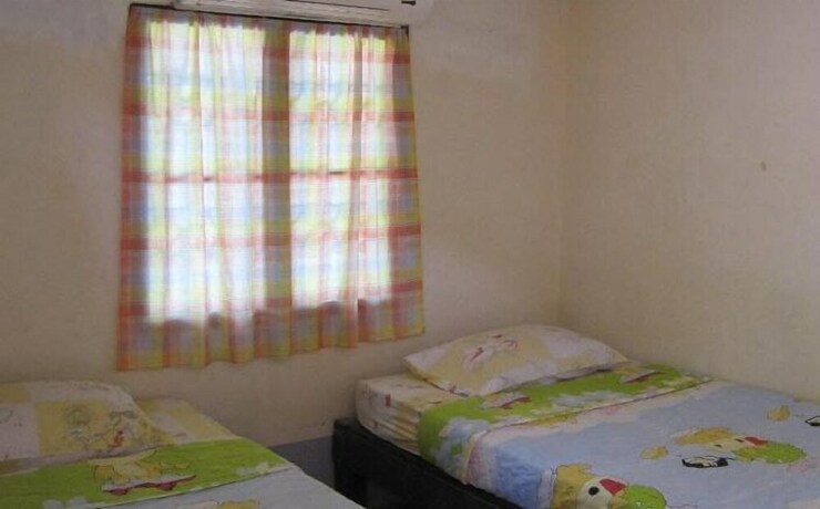 Imagen de la habitación del Hotel Pooltrap Village Bungalow. Foto 17