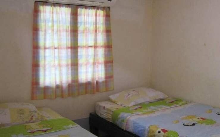 Imagen de la habitación del Hotel Pooltrap Village Bungalow. Foto 25