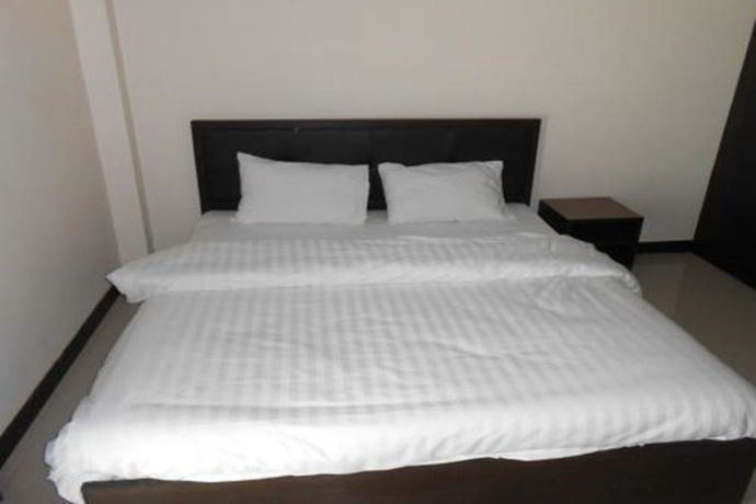 Imagen de la habitación del Hotel Poomsiri Place. Foto 8