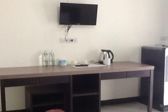 Imagen de la habitación del Hotel Poomsiri Place. Foto 9