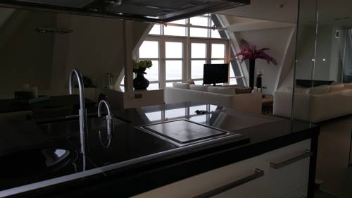 Imagen de la habitación del Hotel Poort Beach Apartments. Foto 2