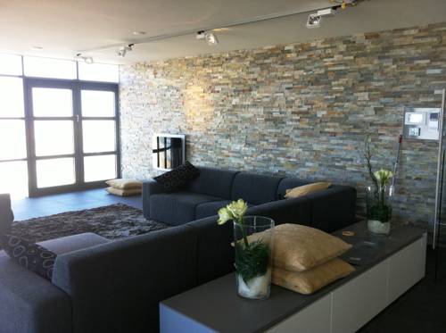 Imagen de la habitación del Hotel Poort Beach Apartments. Foto 5