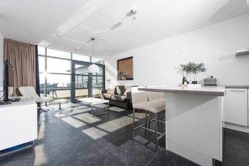 Imagen de la habitación del Hotel Poort Beach Apartments. Foto 10